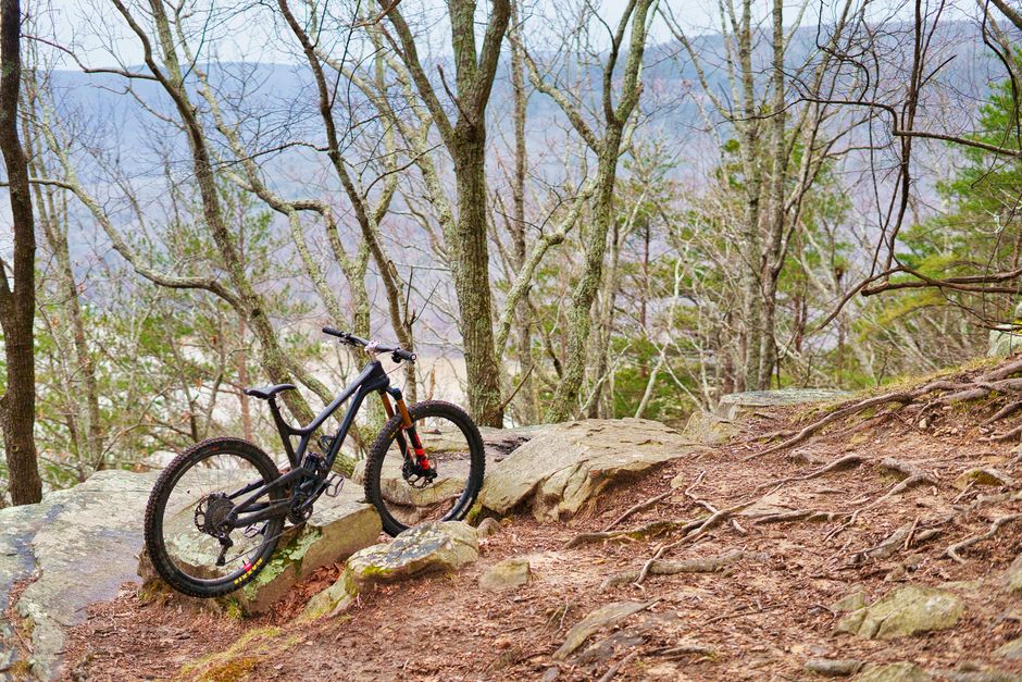 A mountain bike on a rocky trail in a forested area of Tennessee.